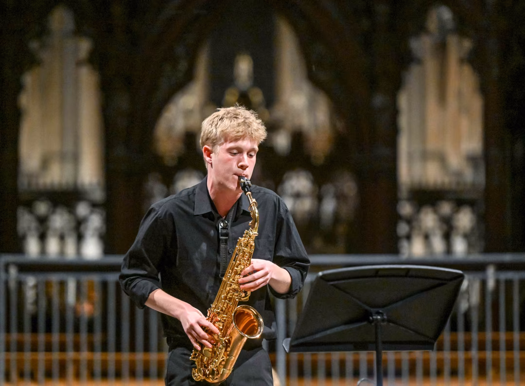 James performs in the finals of the Interhouse Senior Music Competition in the Cathedral