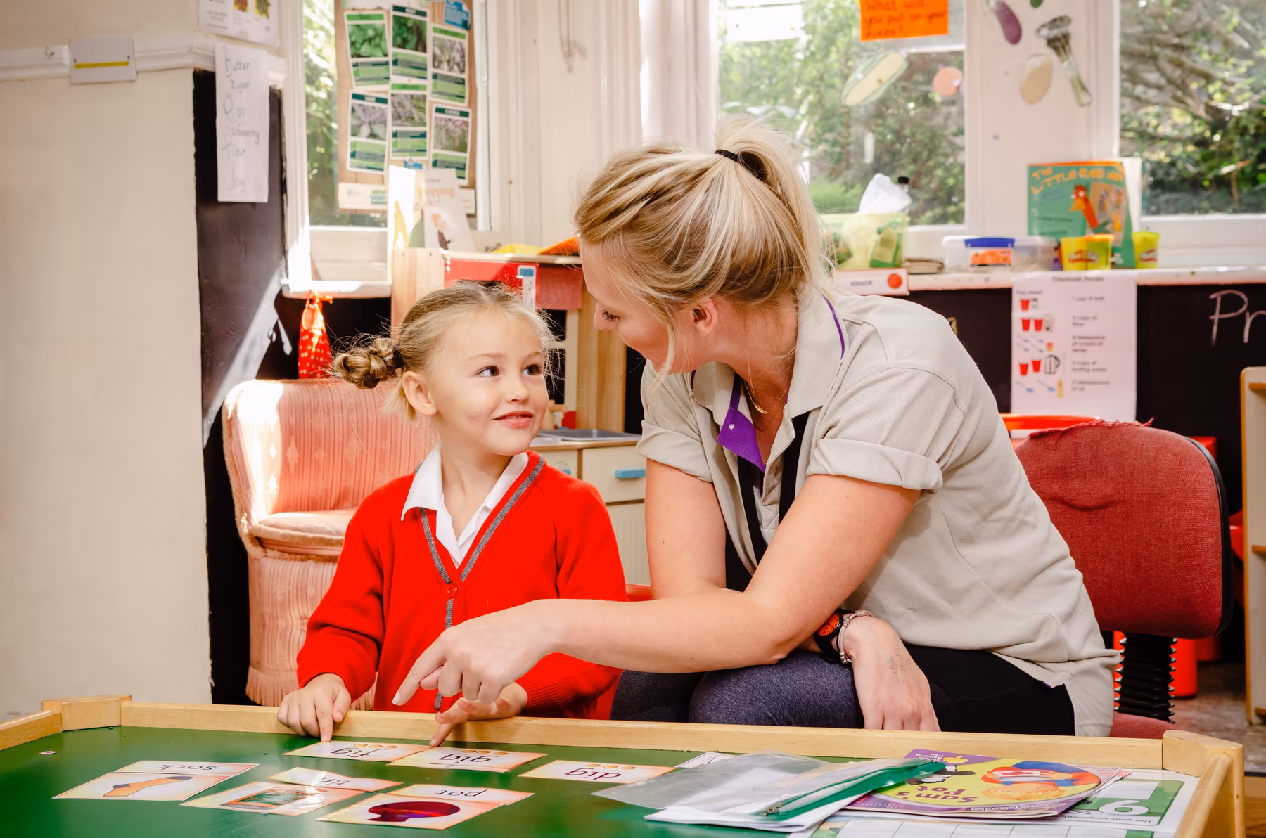 Girl pupil with teacher